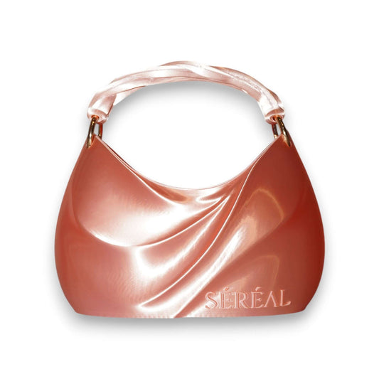 ADORE MUSE 3D-printed handbag ADORE MUSE 3D-printed handbag: Experience the soft elegance of ADORE MUSE — a 3D Printed Designer Bag inspired by pearls and silk. This sculptural piece captures the essence of refined femininity through fluid lines, gentle c