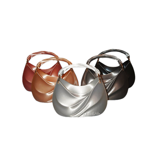 Four "ADORE MUSE" 3D-printed handbags in metallic brown, copper, silver, and black are displayed on a white background. Each features a curved silhouette and single handle, highlighting sustainable designer fashion innovation.