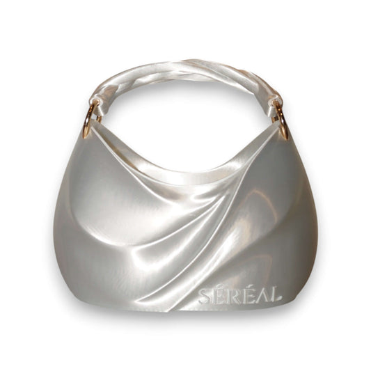 ADORE MUSE 3D-printed handbag ADORE MUSE 3D-printed handbag: Experience the soft elegance of ADORE MUSE — a 3D Printed Designer Bag inspired by pearls and silk. This sculptural piece captures the essence of refined femininity through fluid lines, gentle c